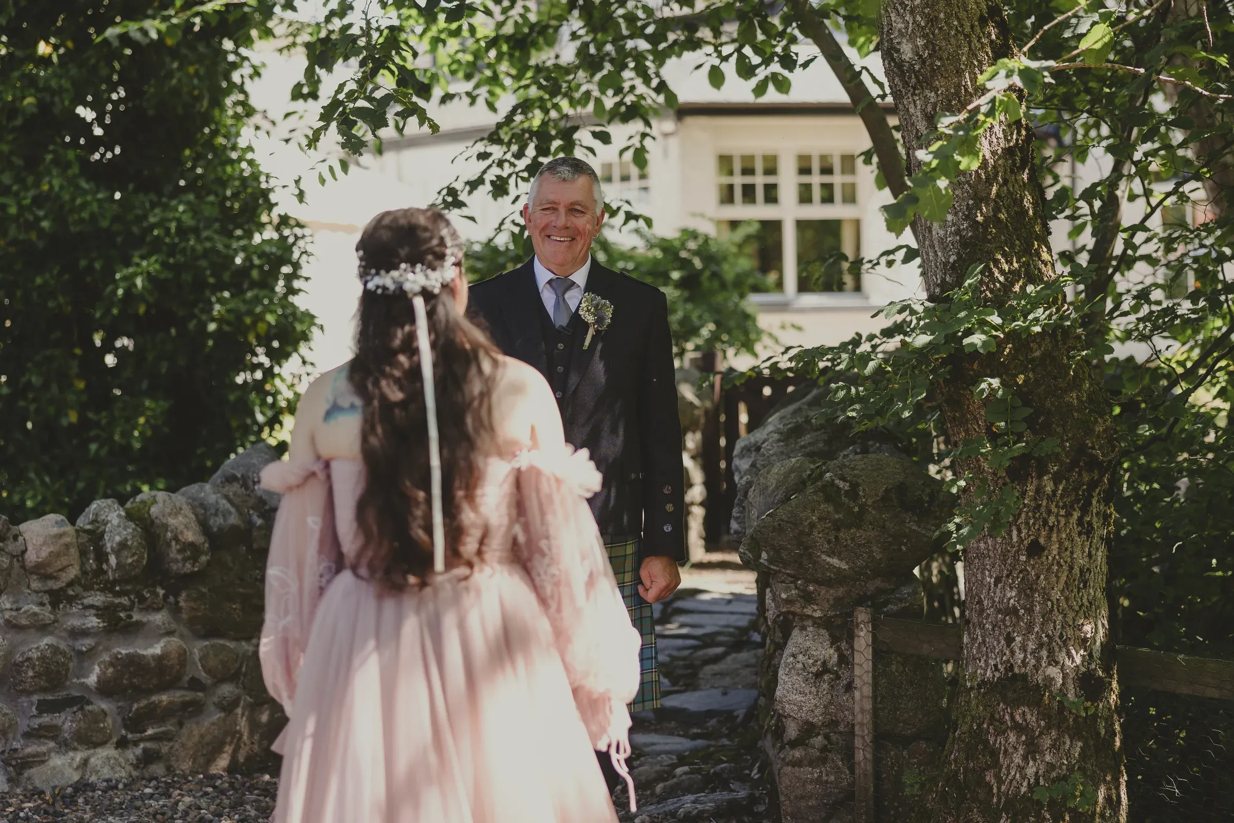 Beth walks up to her father in a heartfelt moment outside one of the Glenclova lodges.