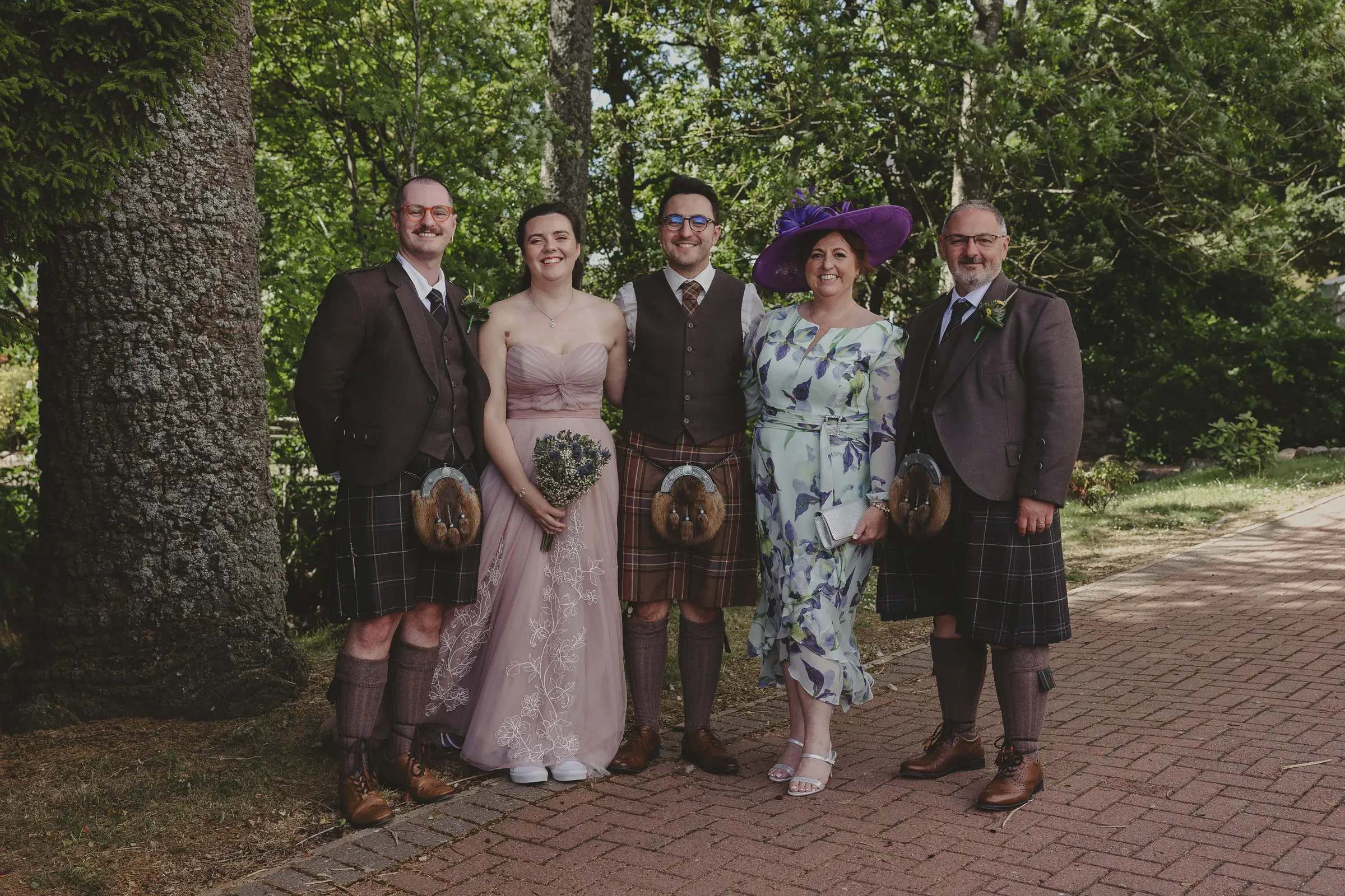 Beth and Blair pose for a happy group portrait with their parents at Glenclova.