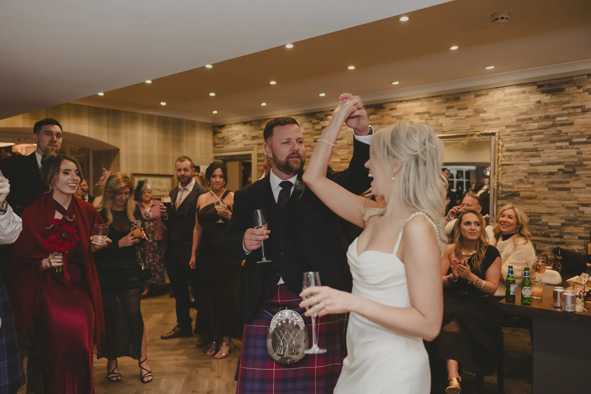 Katie and Kevin celebrate their wedding with guests dancing and enjoying drinks at the after-party.