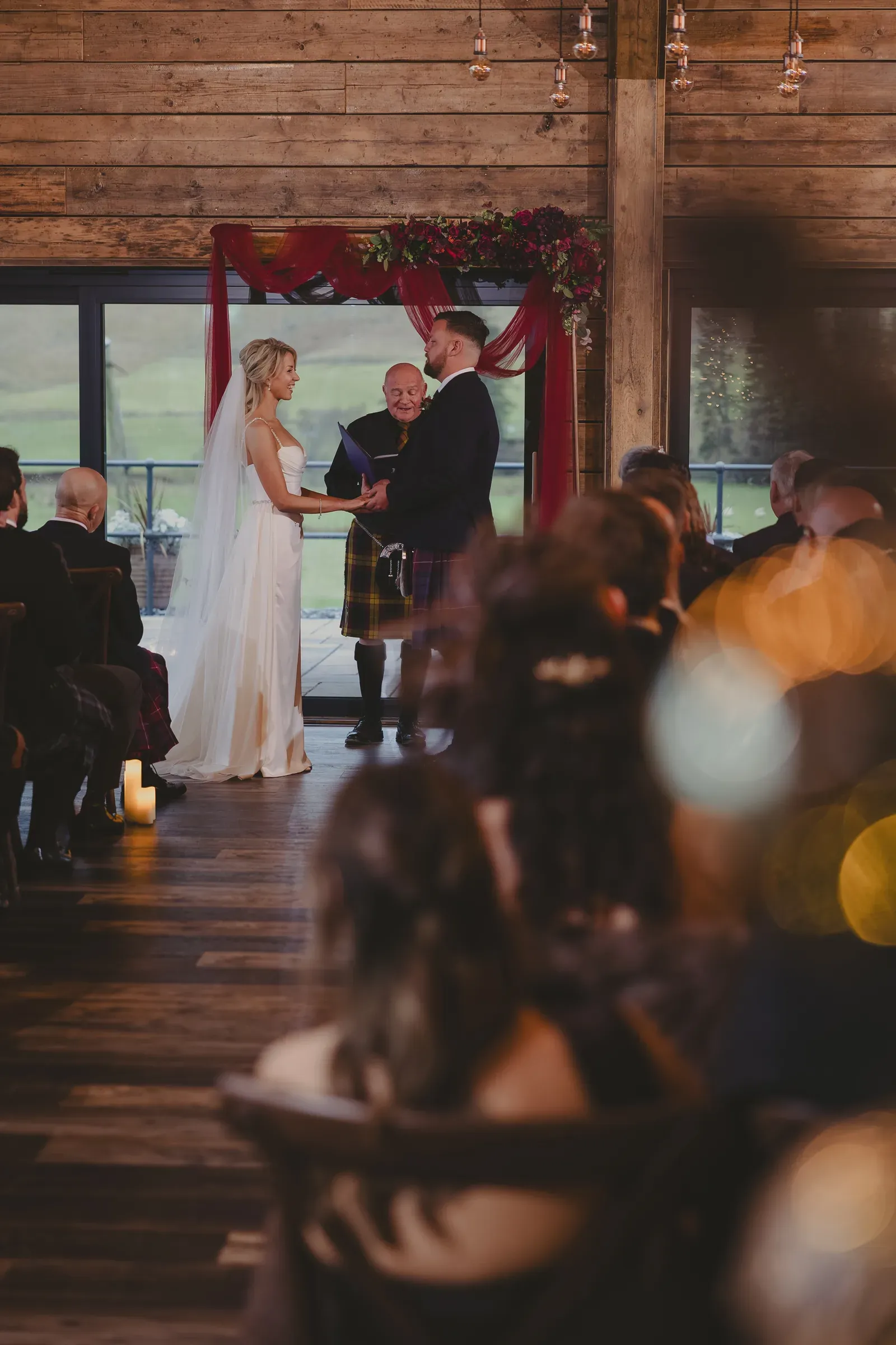 Kevin and Katie stand together at the altar during their wedding ceremony at Glenclova.