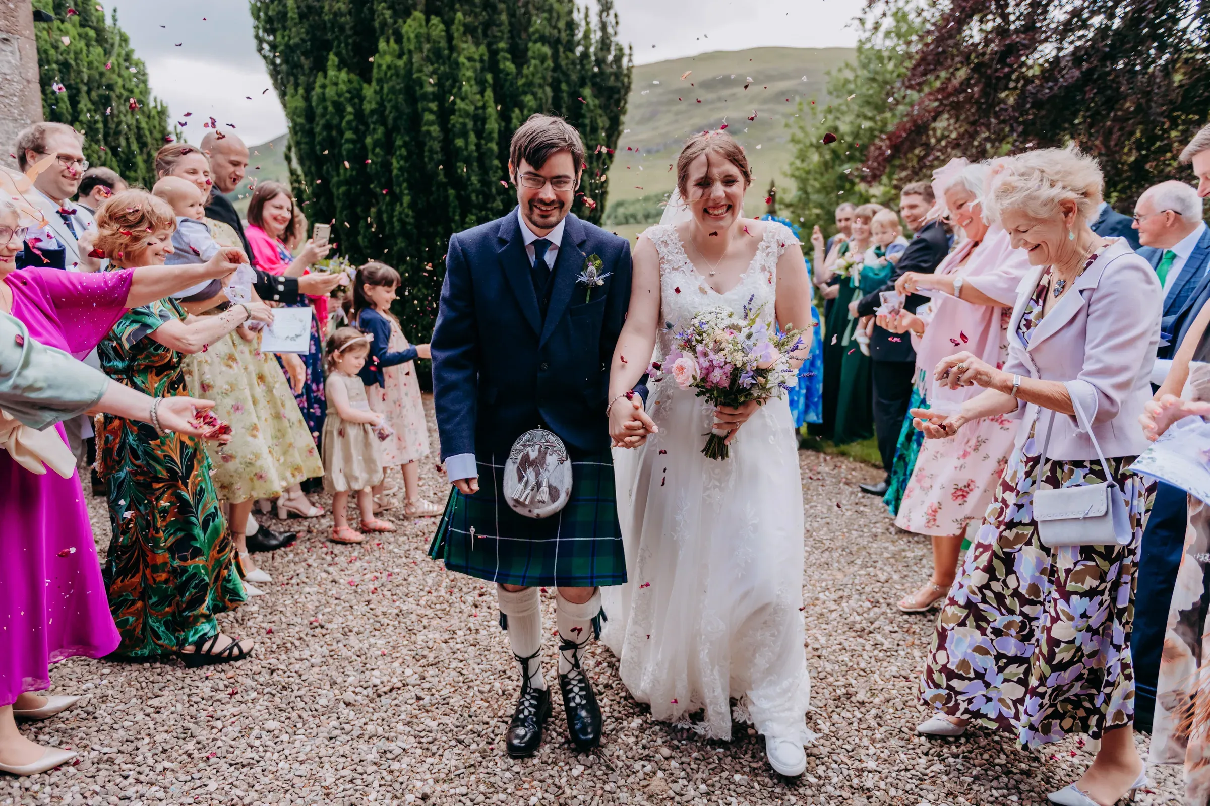 Heather & Lewis, a blessing stone passed around the kirk, and confetti on the glen