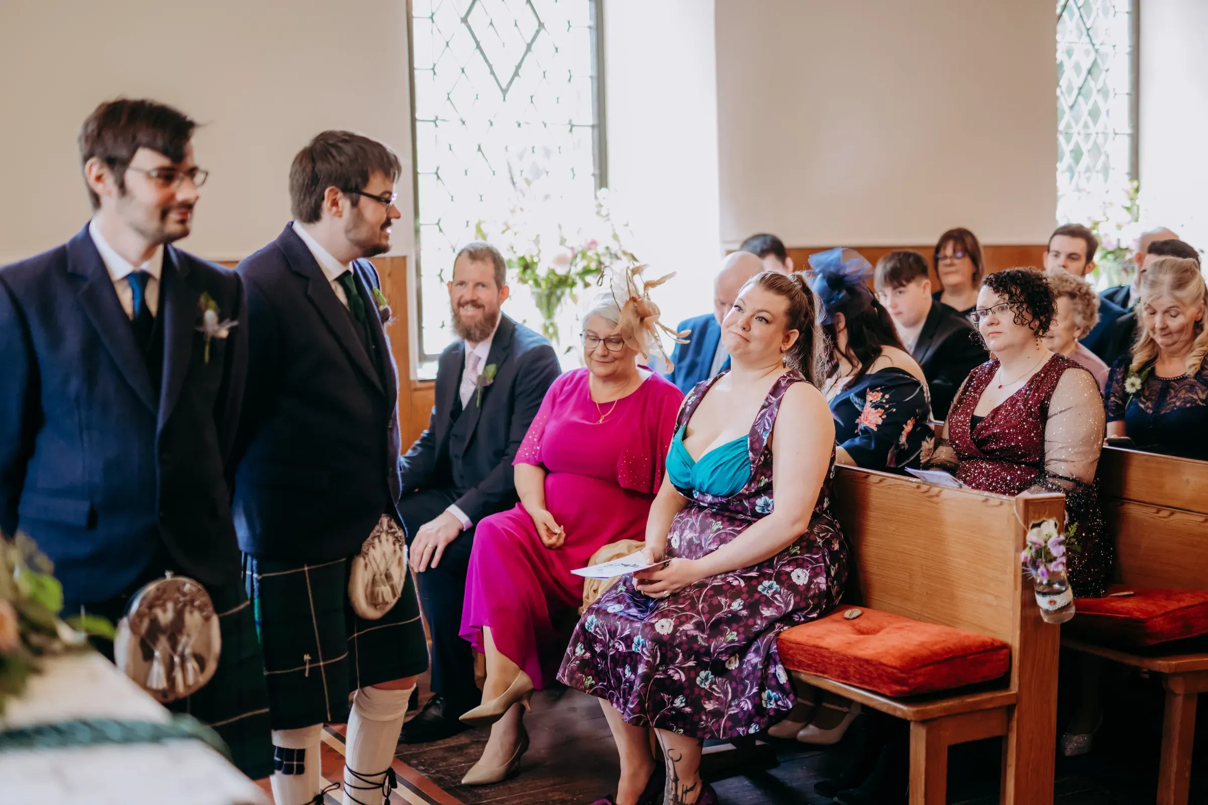 A happy group of wedding guests gathered inside the Glenclova kirk for a ceremony.