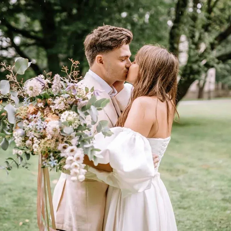 A happy couple shares an intimate moment at Glenclova, perfect for showcasing the venue's suitability for smaller weddings.