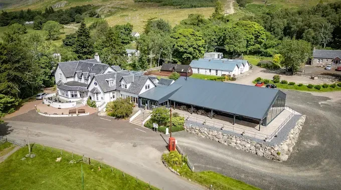 An aerial view of the Glenclova venue buildings nestled within the Scottish Highland landscape.