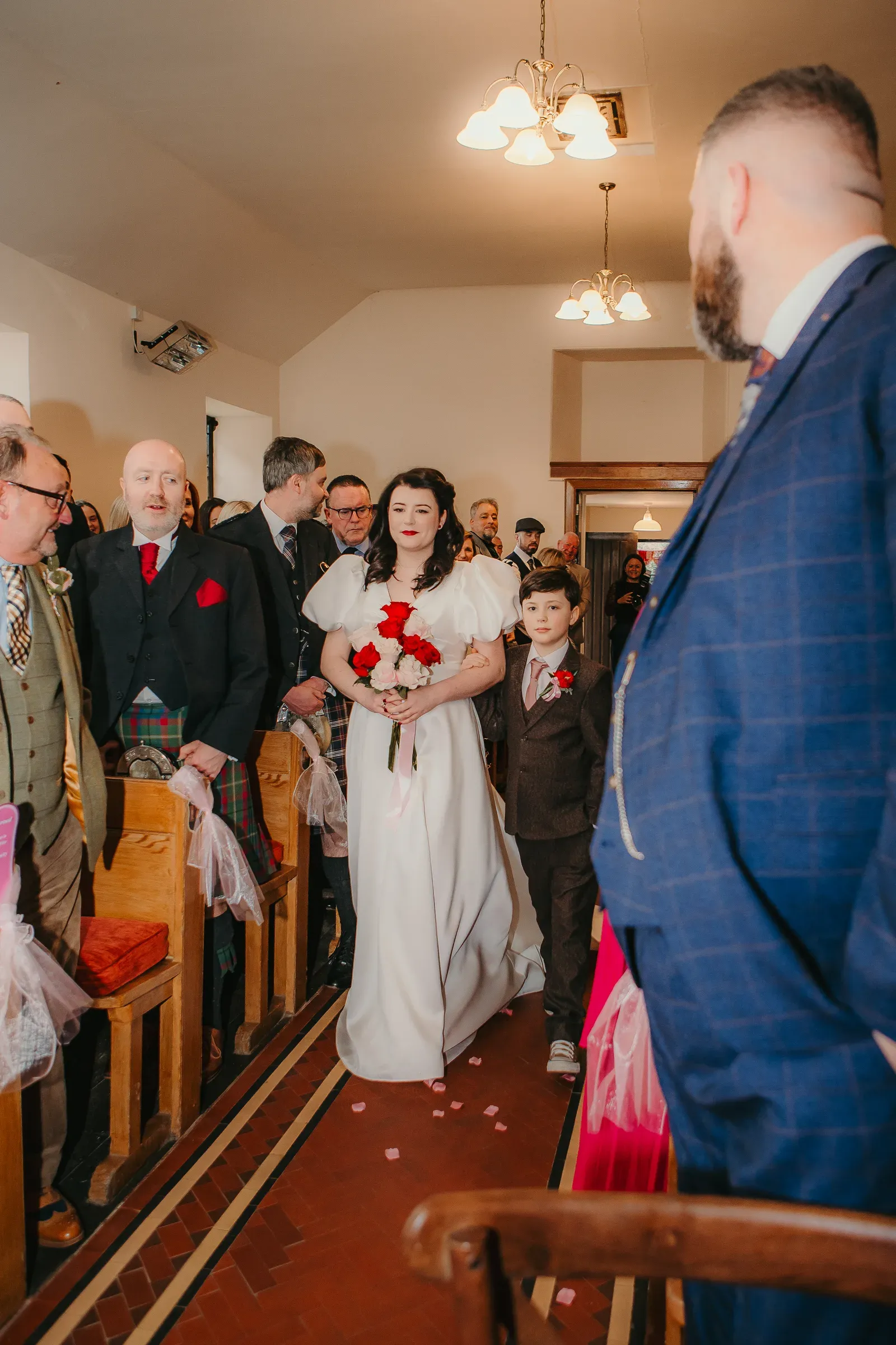 Meg walks down the aisle inside the Kirk during her wedding ceremony.