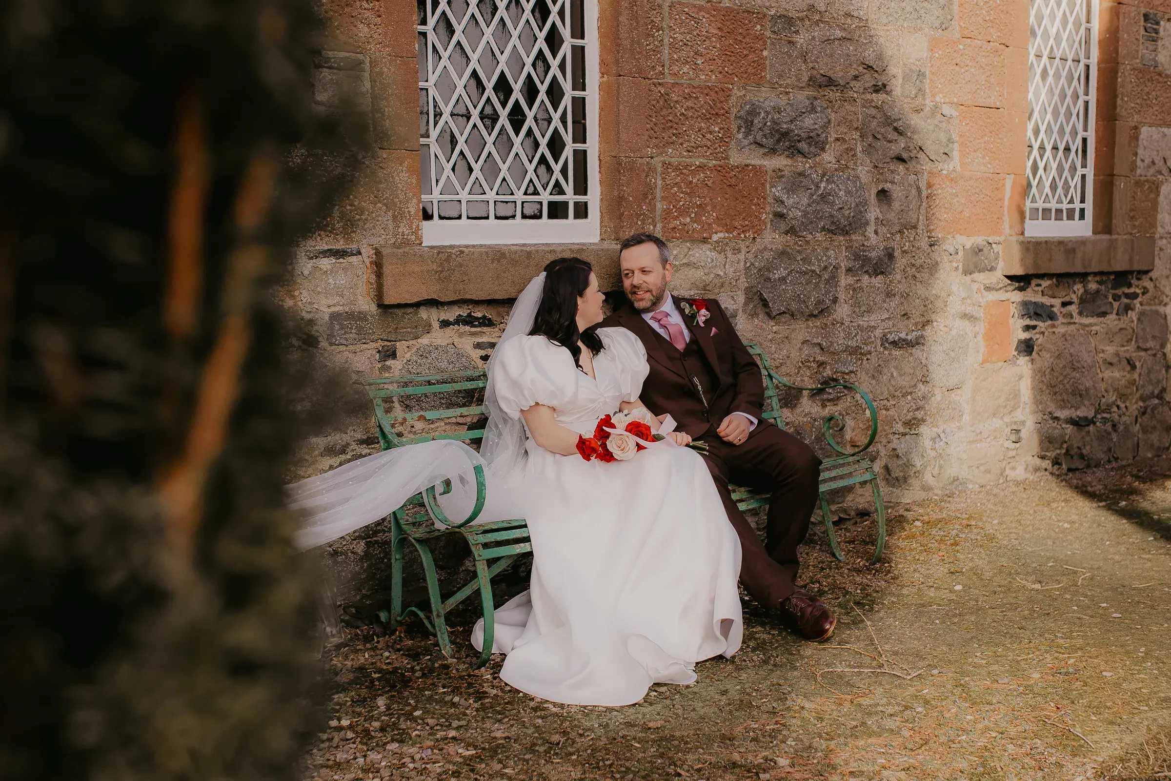 Meg & Ryan, a packed Clova Kirk, her son walking her down the aisle, and colour everywhere