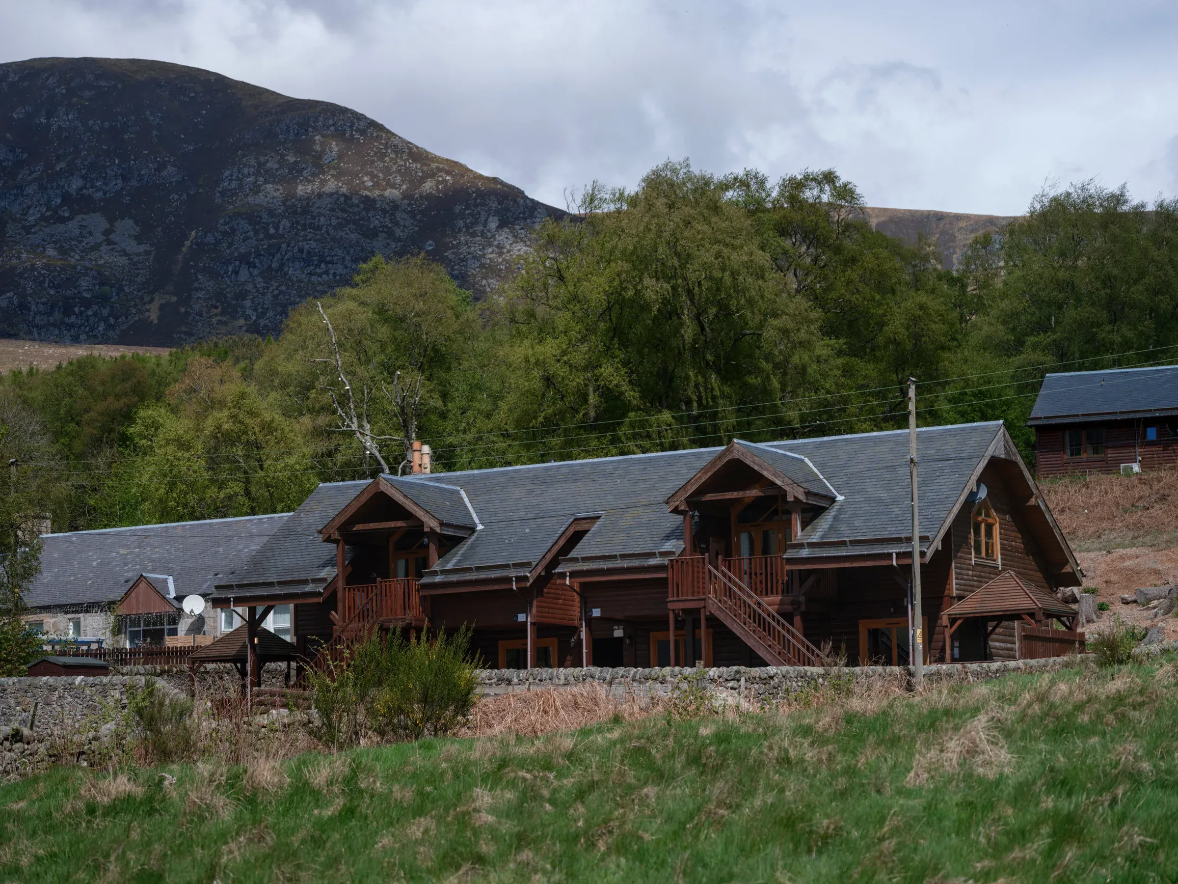 An exterior view of the large double lodge situated within the glen.