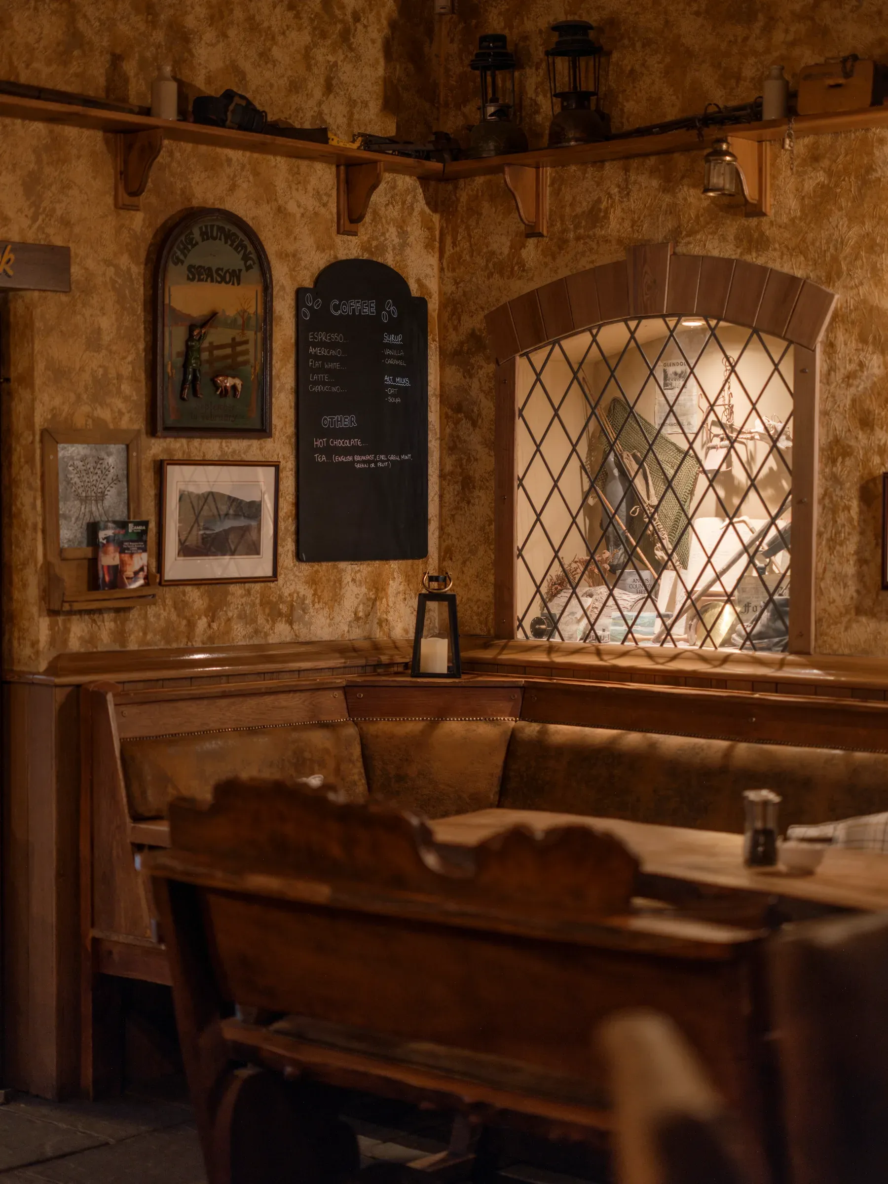 A vertical view of the cozy, rustic interior of the Glenclova bothy.