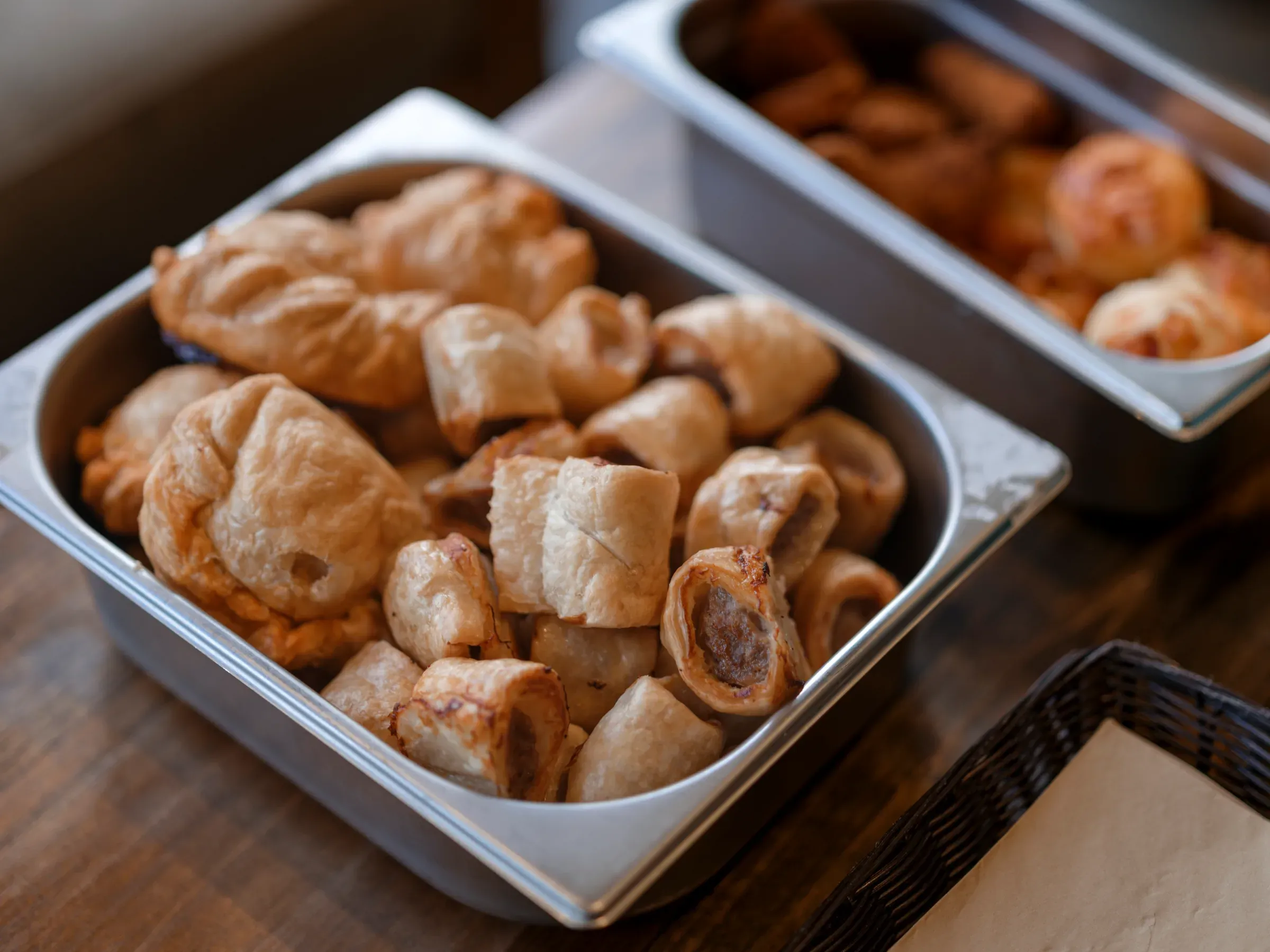 A close-up shot of a buffet tray filled with assorted savoury pastries.
