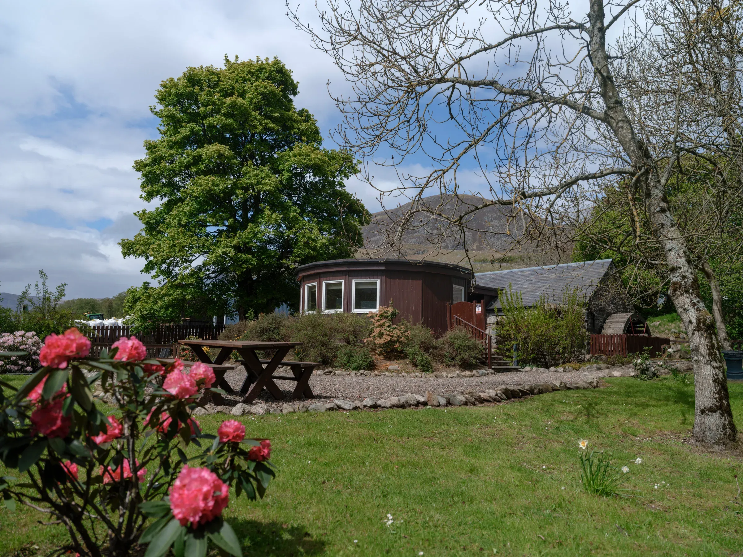 A view of the lodge exterior set within the scenic grounds of the glen.